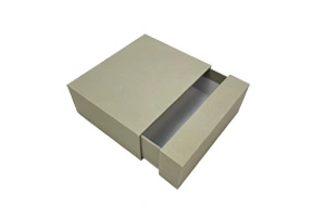 A minimalist grey kraft paper drawer-style rigid box with a smooth slide-out mechanism. This eco-friendly packaging is manufactured in ZY Pack's 10,000㎡ facility in Wenzhou, China, using 10 fully automated lines to ensure precise structural engineering and high daily capacity