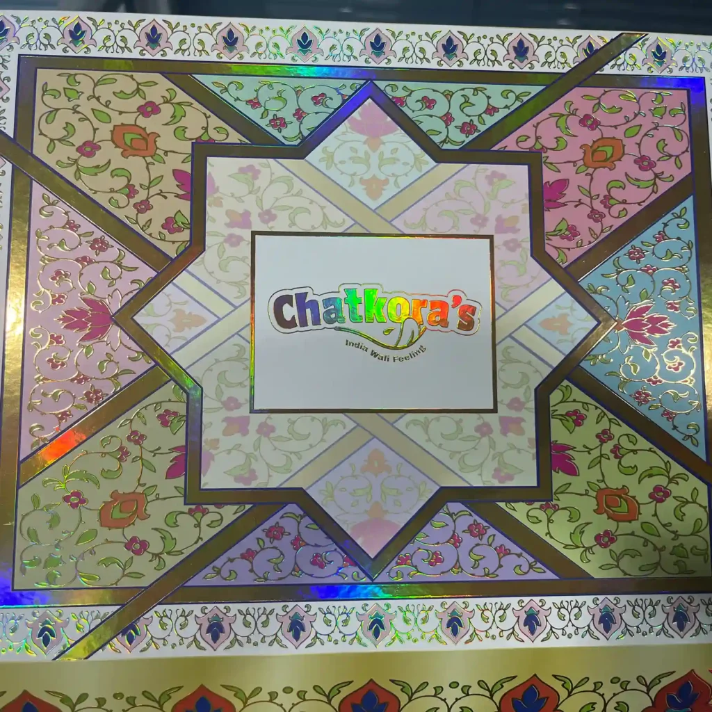 Clamshell Rigid Box Intricate holographic laser foil stamping and precision gold hot foil on a luxury rigid box by ZY Pack