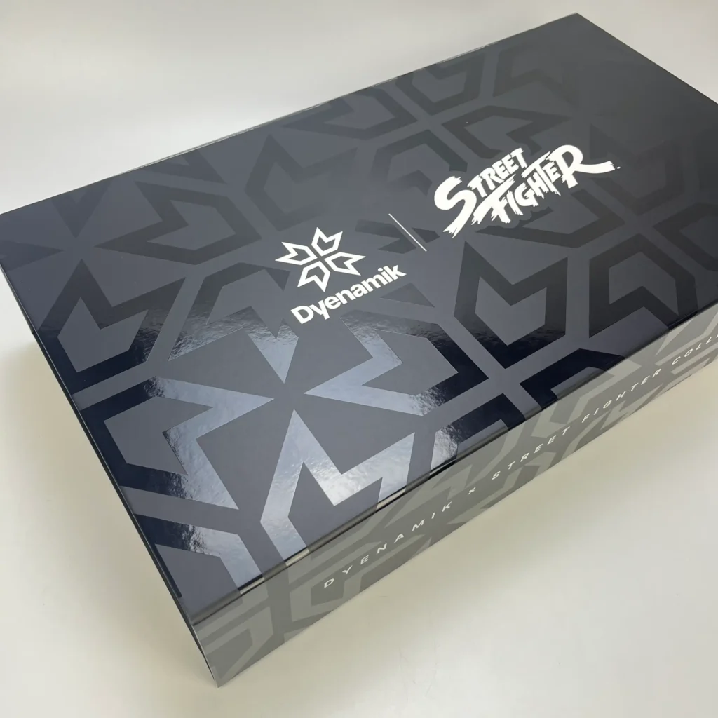 High-end luxury black rigid box featuring a vibrant colored spot UV pattern on a massive surface. This oversized packaging demonstrates ZY Pack's ability to maintain precise coating alignment and color depth on large-scale premium gift boxes