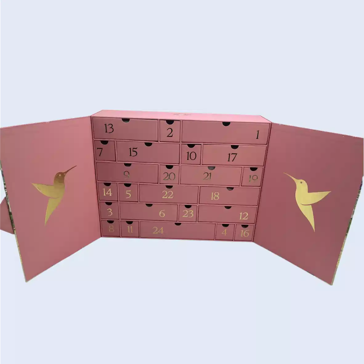 Beauty & Skincare Packaging Luxury pink double-door advent calendar box with 24 custom drawers and gold foil hummingbird patterns on the inner panels, manufactured by ZY Pack.