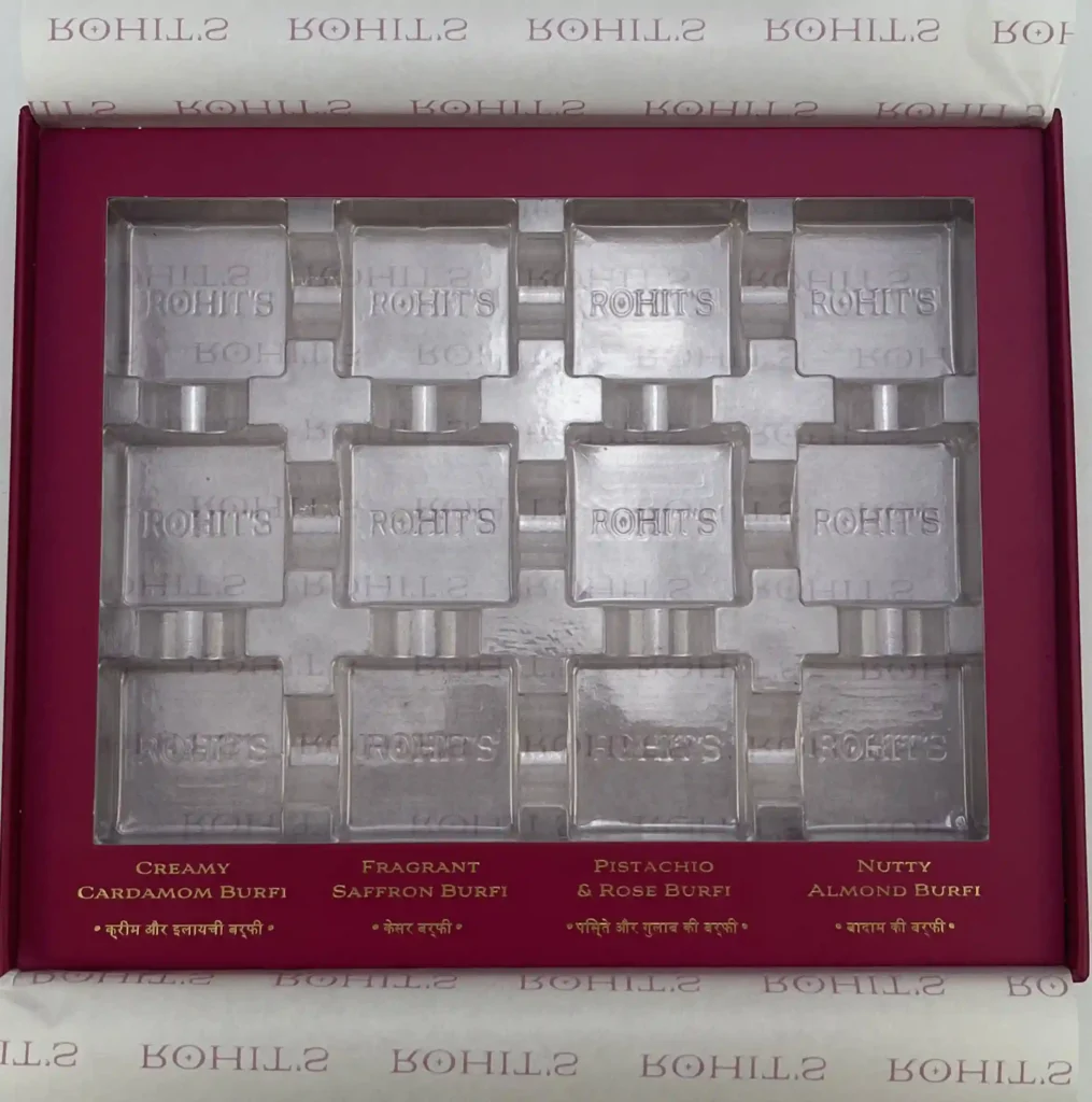 Transparent PET blister insert inside a custom printed box with a red border. High-visibility packaging solution with low mold costs, ideal for retail display.