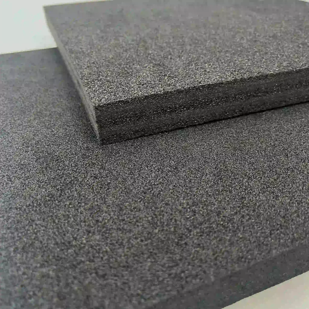 Close-up of black IXPE foam sheet showing its ultra-fine, physically cross-linked cell structure. A waterproof, non-abrasive, and chemically stable alternative to standard EPE foam for medical and precision use.