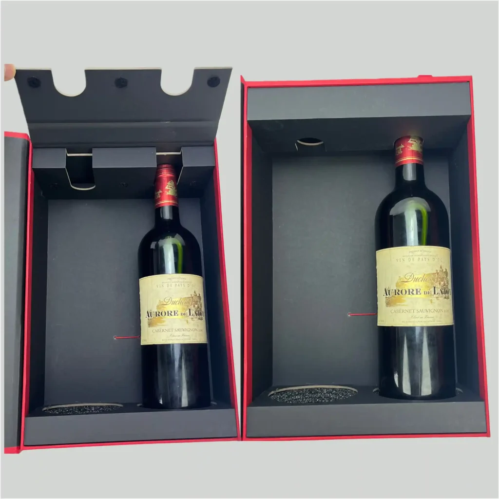 Black luxury rigid insert holding a glass wine bottle. Made from black cardstock wrapped over thick greyboard using V-grooving technology for sharp, seamless edges.