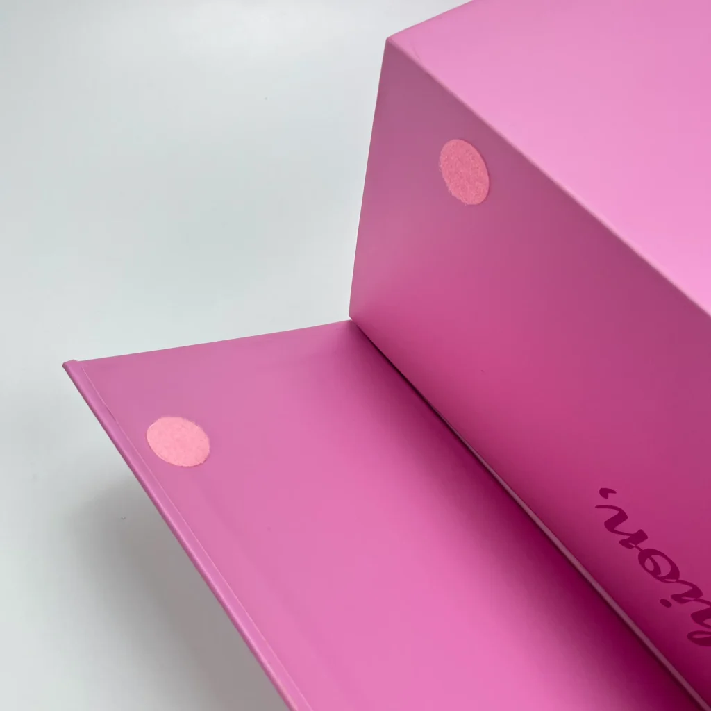 An extra-large folding gift box in the open position, showing the precise placement of the custom color-matched Velcro closure points.