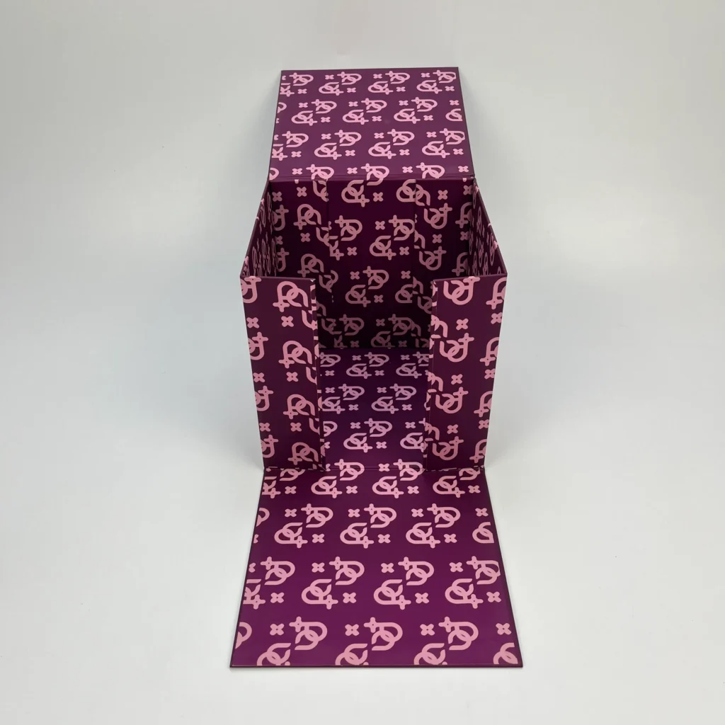 Multi-magnet cube folding rigid box partially assembled showing tall cubic structure with full custom monogram print on exterior and interior walls