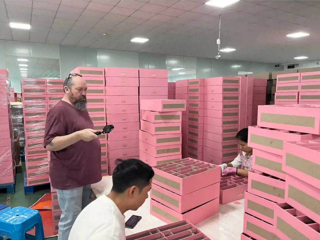 Real factory view of advent calendar production for Australian client Jason from Arid Zone Australia inspecting advent calendar packaging production at ZY Pack