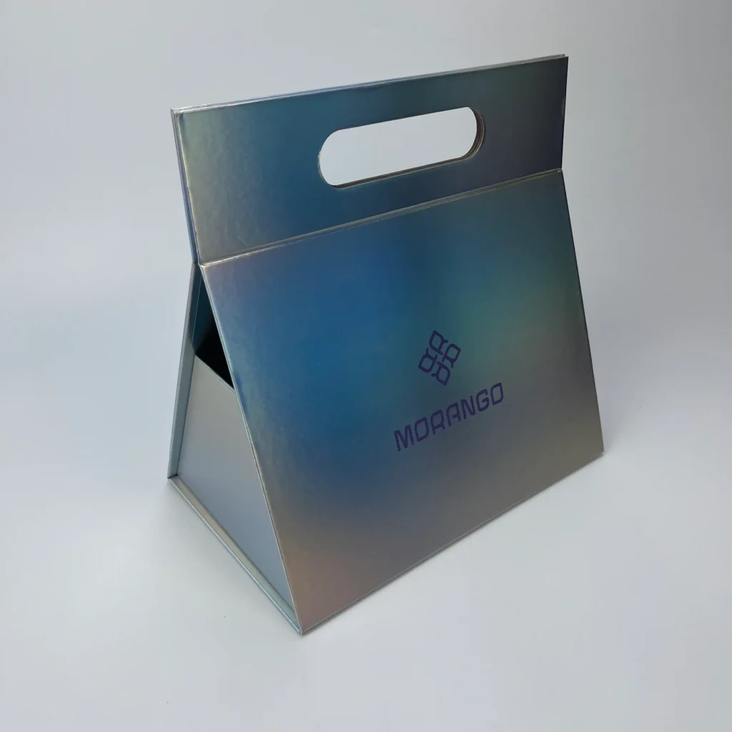 Assembled holographic collapsible triangle rigid box with die-cut top handle and custom brand print combining gift box and carrying bag in one structure