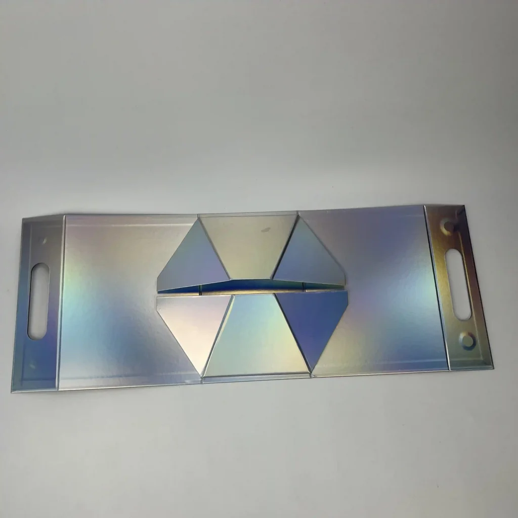 Holographic collapsible triangle rigid box folded flat showing die-cut carry handle and folding gusset structure for space-saving shipping