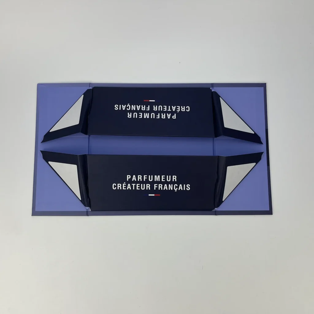 Collapsible rigid box base folded completely flat showing two-piece luxury gift box flat pack structure for efficient bulk shipping