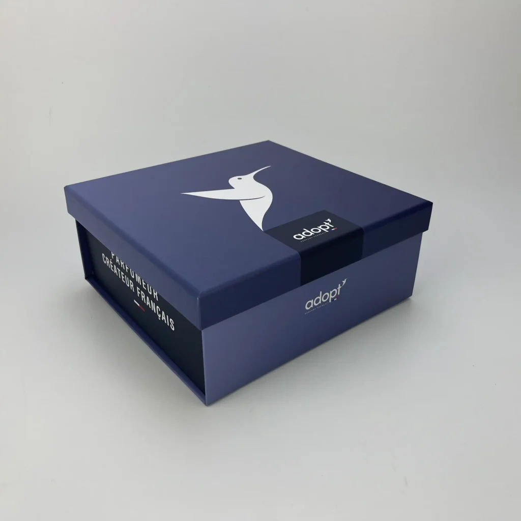 Navy blue collapsible two-piece rigid gift box with custom printed lid and magnetic base showing assembled luxury packaging exterior