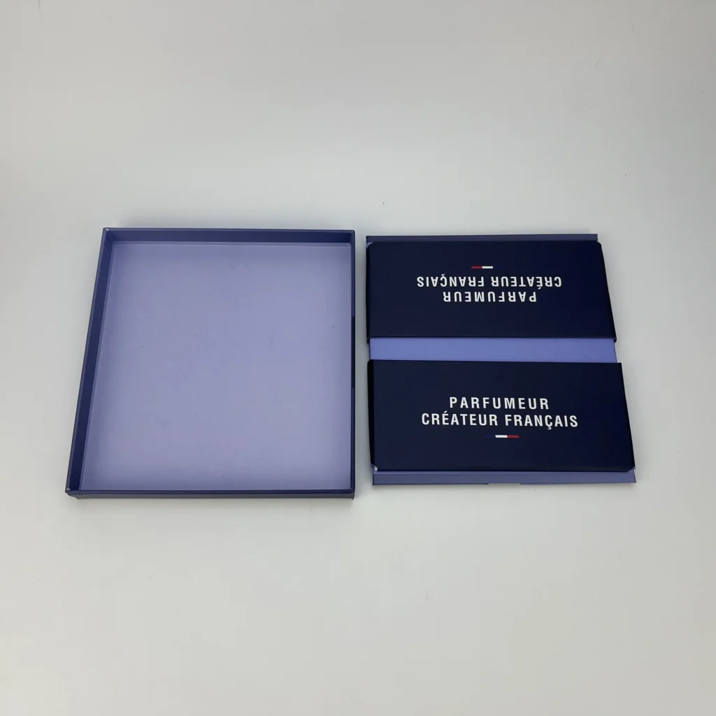 Collapsible two-piece rigid box with lid removed showing lavender interior base and separate printed magnetic lid structure