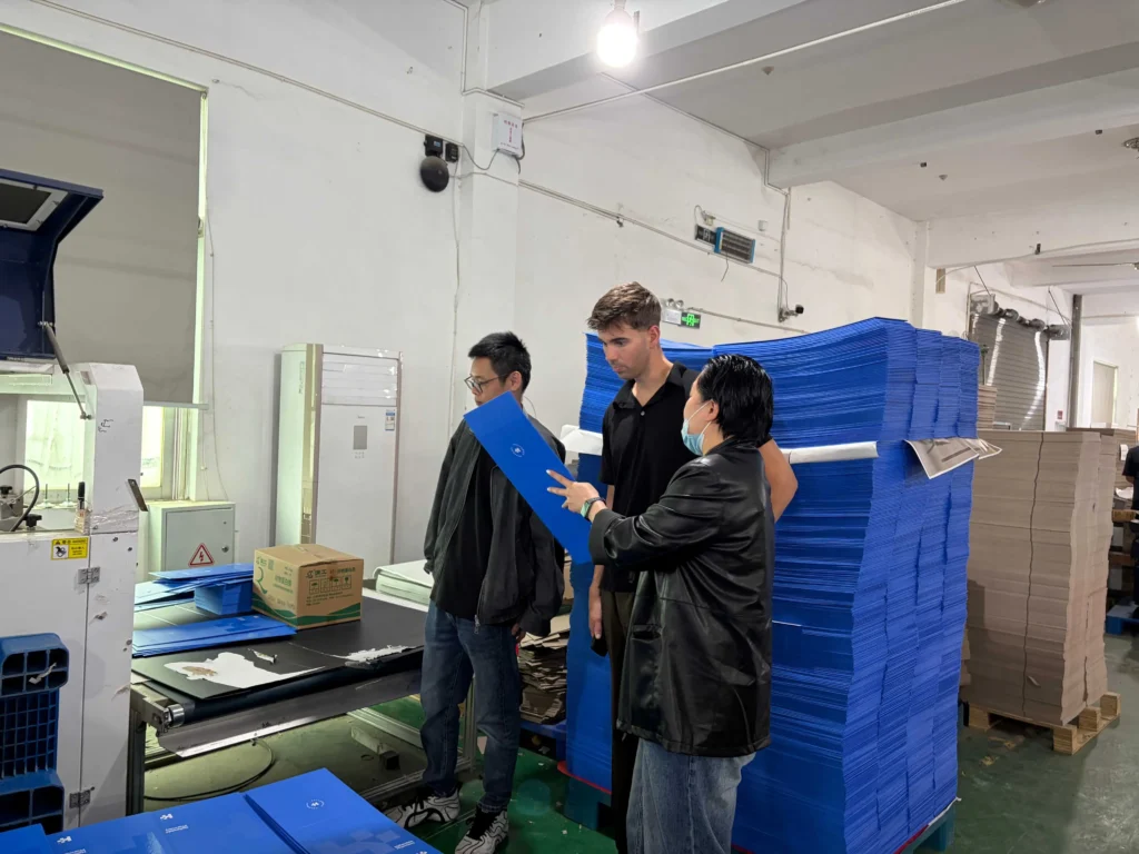 Quality control of collapsible rigid boxes with Australian packaging expert Jordan Shreeve from Inke Packaging Australia checking collapsible box panel quality at ZY Pack.