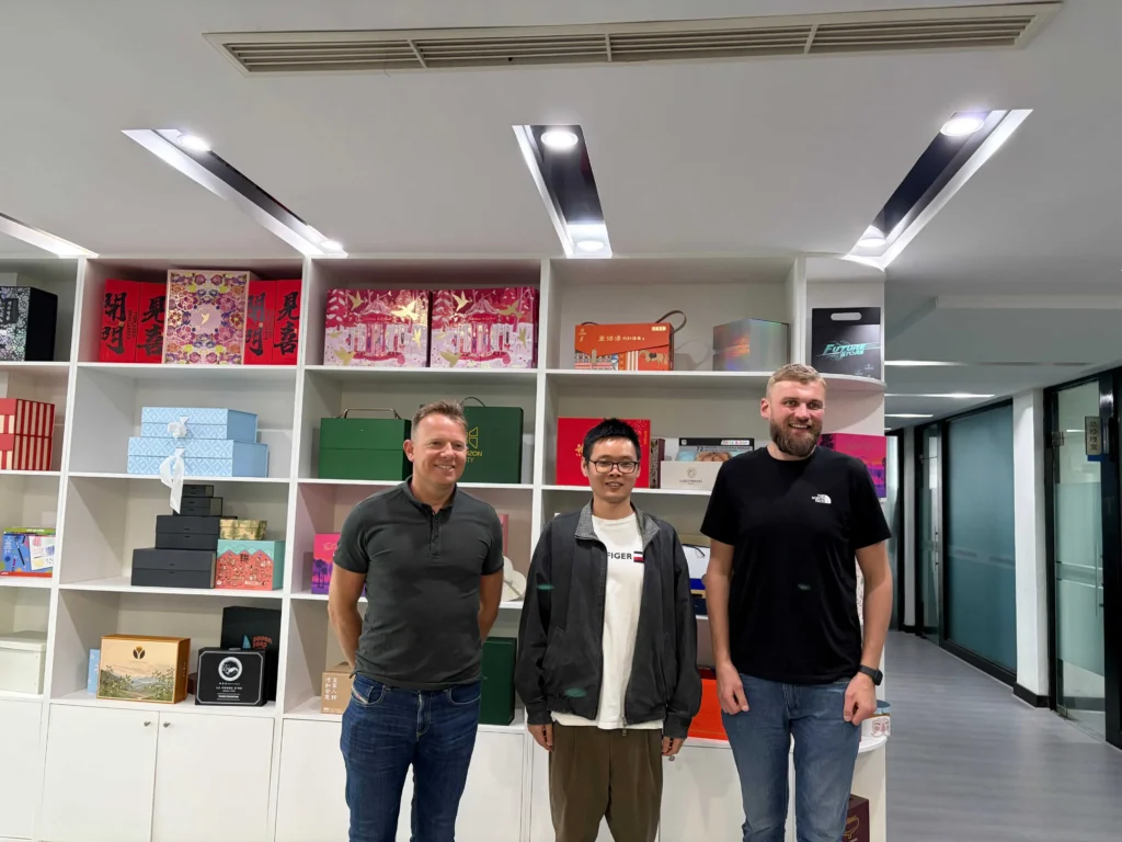 Long-term partnership between UK clients and ZY Pack factory TDI Tuning UK team group photo with Steven Cai in ZY Pack packaging sample room
